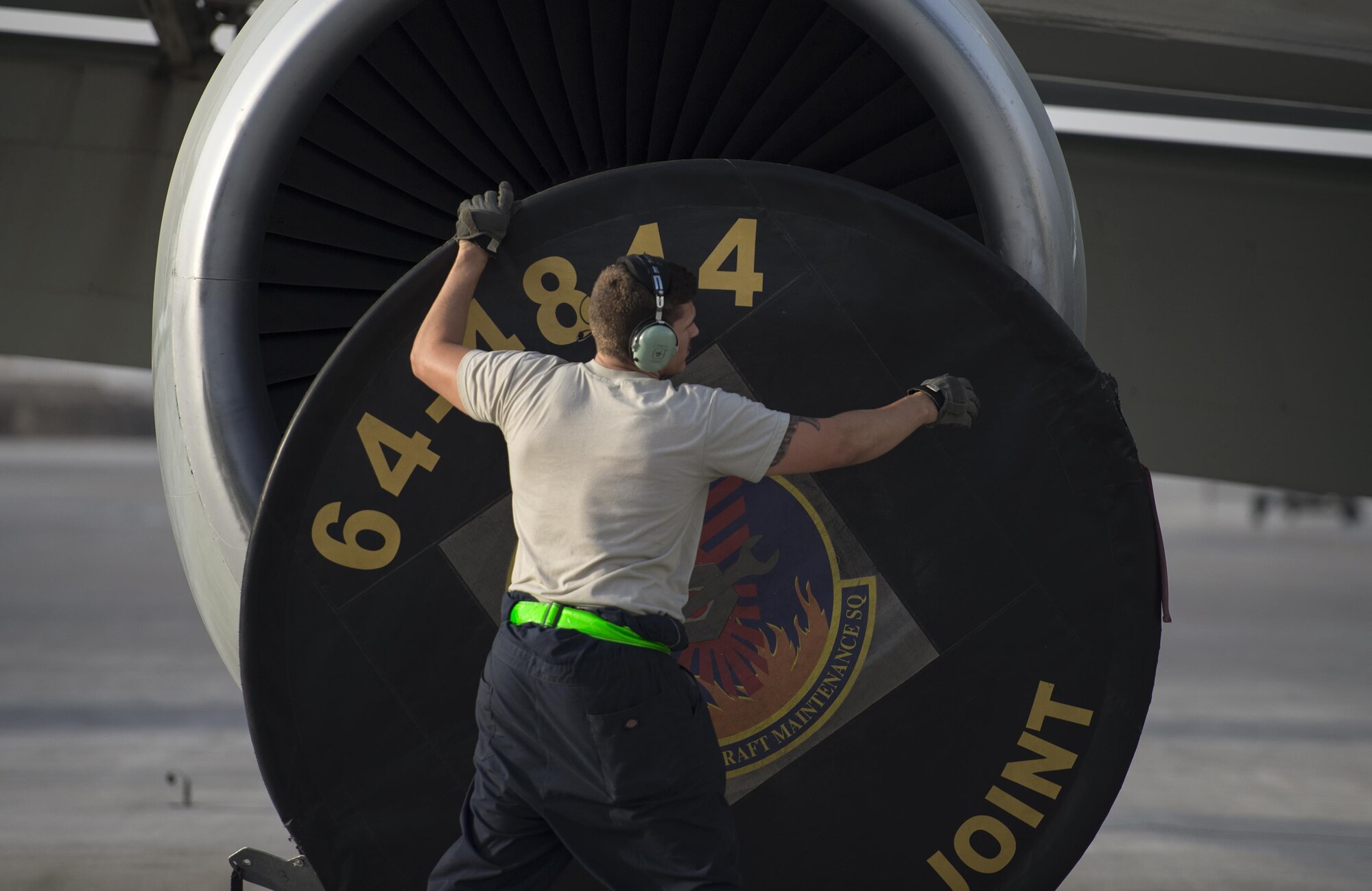 U.S Air Force Airman 1st Class Zachary Tomcyzk, a guidance and control technician with the 763rd Expeditionary Aircraft Maintenance Unit, removes the engine cover to a RC-135V/W Rivet Joint at Al Udeid Air Base, Qatar, July 4, 2017.  Tomcyzk in preparation of a flight the RC-135V/W Rivet Joint provides near real time on-scene intelligence collection and analysis throughout the U.S. Air Forces Central Command area of responsibility. (U.S. Air Force photo by Tech. Sgt. Amy M. Lovgren)