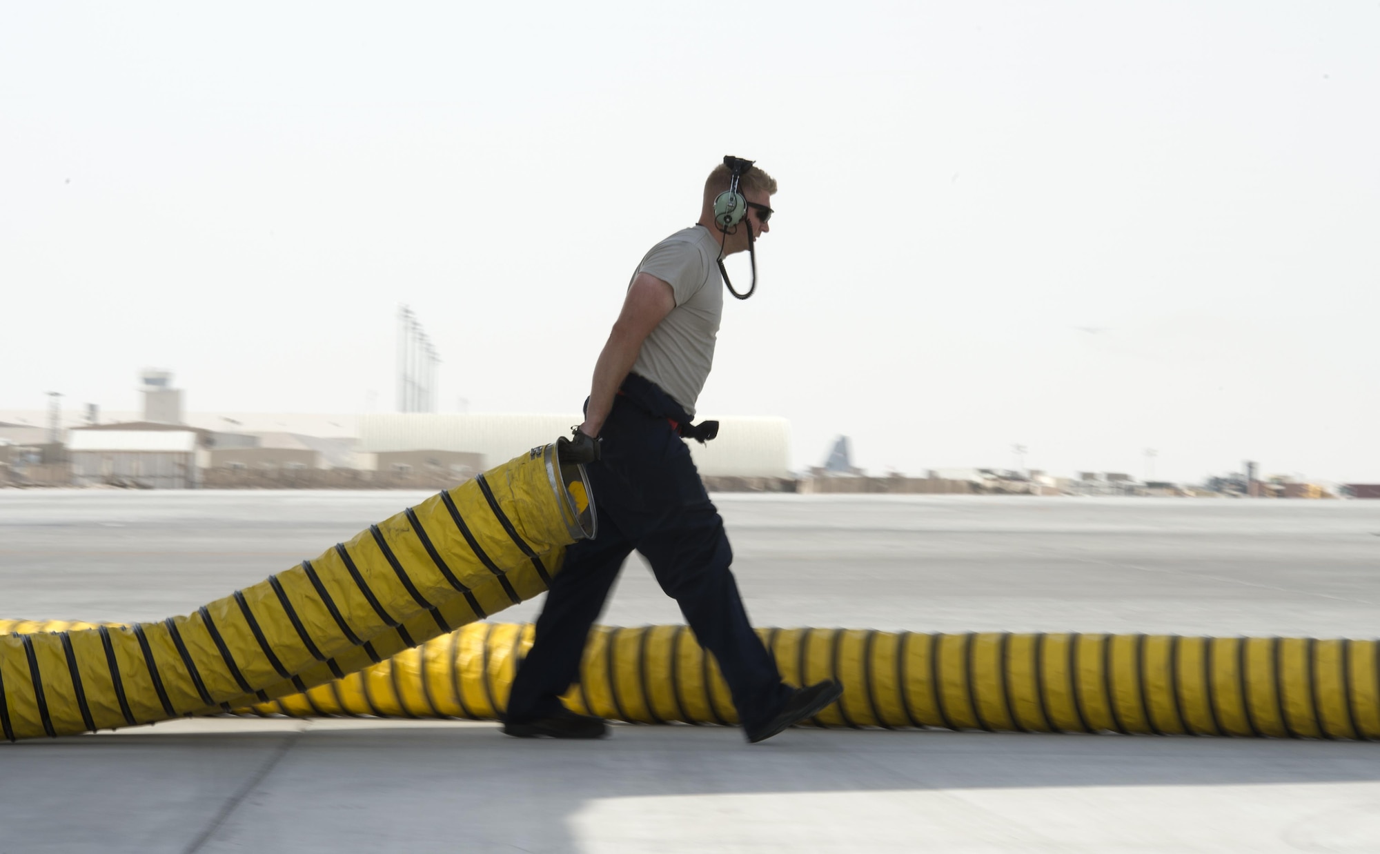 U.S Air Force Staff Sgt. Bruce Boland, a hydraulic technician with the 763rd Expeditionary Aircraft Maintenance Unit, removes air conditioning hose to a RC-135V/W Rivet Joint at Al Udeid Air Base, Qatar, July 4, 2017.  Boland is responsible for keeping the RC-135V/W Rivet Joint operational so it can provide near real time on-scene intelligence collection and analysis throughout the U.S. Air Forces Central Command area of responsibility. (U.S. Air Force photo by Tech. Sgt. Amy M. Lovgren)