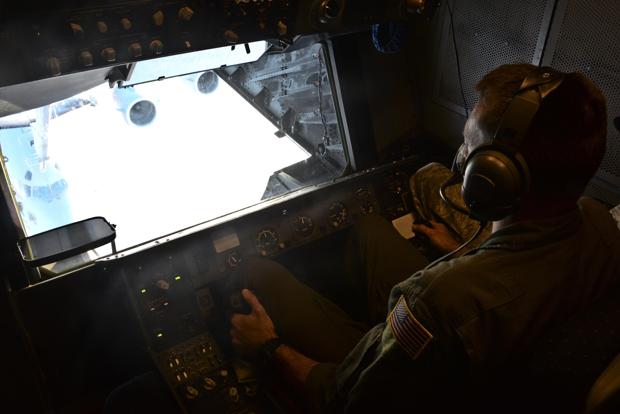 U.S. Air Force Tech. Sgt. Daniel Flenniken, 6th Air Refueling Squadron boom operator, Travis Air Force Base, California, refuels a C-17 Globemaster III over the Pacific Ocean during Exercise Ultimate Reach July 13, 2017. During the operation, three KC-10s from Travis AFB and Joint Base McGuire-Dix-Lakehurst, New Jersey, refueled five C-17s carrying more than 300 coalition paratroopers. The C-17s went on to conduct a strategic air drop over Australia in support of Exercise Talisman Saber 2017. (U.S. Air Force photo by 2nd Lt. Sarah Johnson)