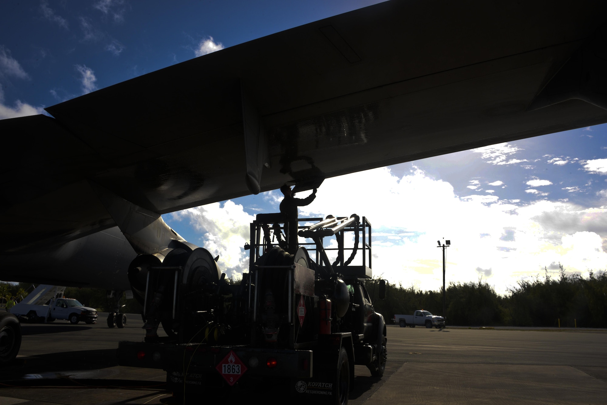U.S. Air Force Staff Sgt. Jacob St. George, 660th Aircraft Maintenance Squadron crew chief, refuels a KC-10 Extender at Wake Island July 12, 2017. A combined crew from the 6th and 9th ARS at Travis supported Exercise Talisman Saber 2017 by executing Exercise Ultimate Reach, a strategic refueling and airdrop mission in which three KC-10s refueled five C-17 Globemaster IIIs carrying U.S. Army, Australian and Canadian paratroopers prior to an airdrop. TS 17 is a biennial exercise in Australia that focuses on bilateral military training between U.S. Pacific Command forces and the Australian Defence Forces to improve U.S.-Australia combat readiness, increase interoperability, maximize combined training opportunities and conduct maritime prepositioning and logistics operations in the Pacific. (U.S. Air Force photo by 2nd Lt. Sarah Johnson)