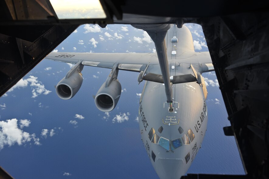 A KC-10 Extender from Travis Air Force Base, California, refuels a C-17 Globemaster III over the Pacific during Exercise Ultimate Reach July 13, 2017. During the operation, three KC-10s from Travis AFB and Joint Base McGuire-Dix-Lakehurst, New Jersey, refueled five C-17s carrying more than 300 coalition paratroopers. The C-17s went on to conduct a strategic air drop over Australia in support of Exercise Talisman Saber 2017. (U.S. Air Force photo / 2nd Lt. Sarah Johnson)