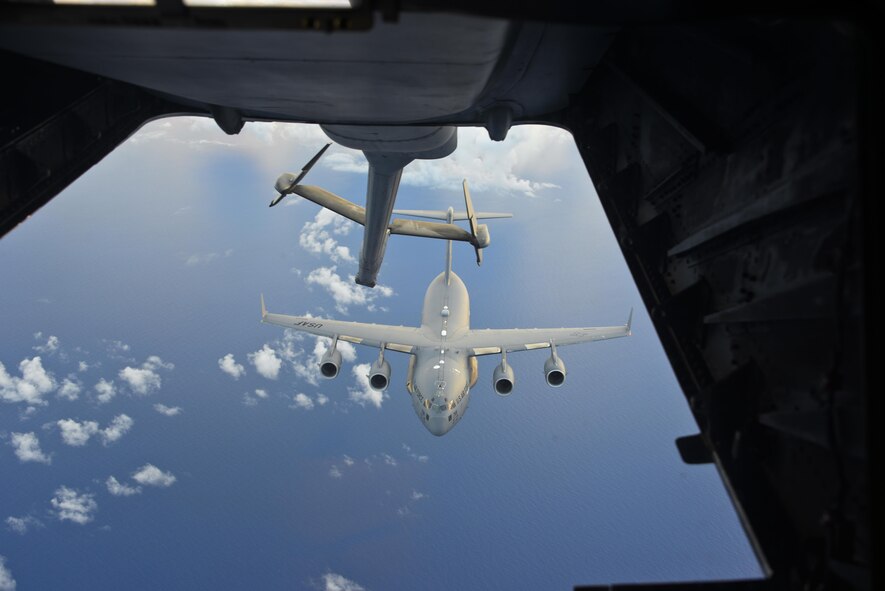 A KC-10 Extender from Travis Air Force Base, California, refuels a C-17 Globemaster III over the Pacific during Exercise Ultimate Reach July 13, 2017. During the operation, three KC-10s from Travis AFB and Joint Base McGuire-Dix-Lakehurst, New Jersey, refueled five C-17s carrying more than 300 coalition paratroopers. The C-17s went on to conduct a strategic air drop over Australia in support of Exercise Talisman Saber 2017. (U.S. Air Force photo / 2nd Lt. Sarah Johnson)