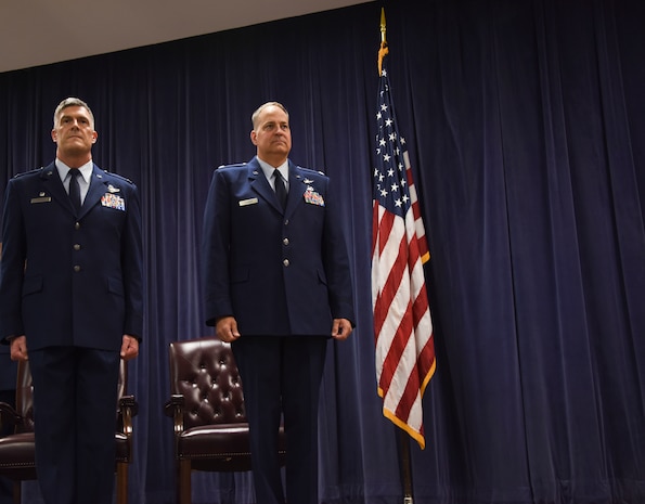 NEW CASTLE AIR NATIONAL GUARD BASE, Del- Col. Robert Culcasi, commander, 166th Airlift Wing, left, and Lt. Col. Trevor Fulmer, vice commander, 166th Airlift Wing, await for the promotion order to be published during a ceremony on July 14, 2017. Fulmer was promoted to Colonel; members of the Delaware National Guard were present to commemorate this achievement. (U.S. Air National Guard photo by Staff Sgt. Alonzo Chapman/ Released). 