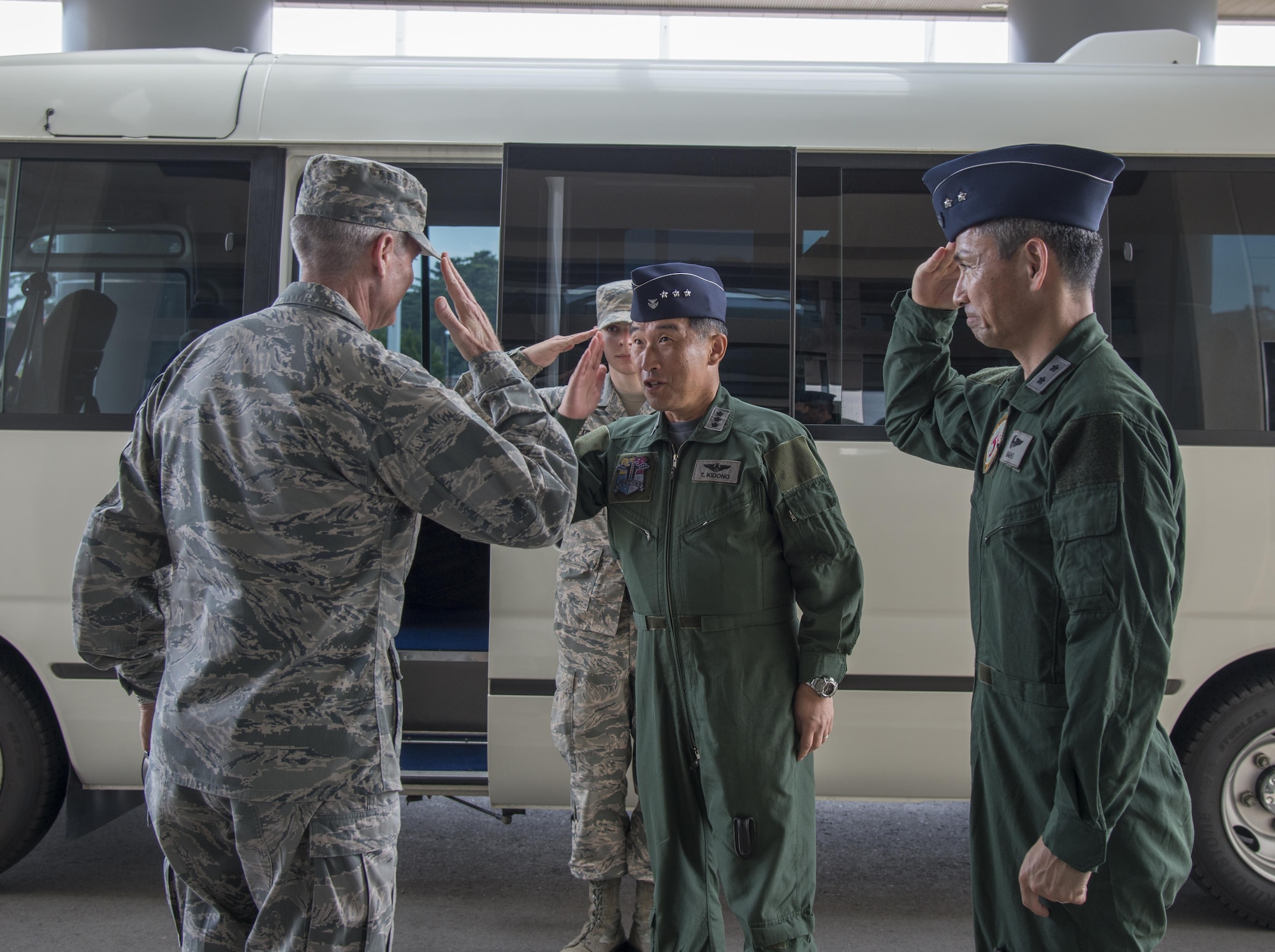 U.S. Air Force Lt. Gen. Darryl Roberson, commander, Air Education and Training Command, salutes Koku-Jieitai Lt. Gen.Tamotsu Kindono, Northern Air Defense Force commander, and Maj. Gen. Koji Imaki, 3rd Air Wing commander, at Misawa Air Base, Japan, July 11, 2017. Roberson visited the 3rd AW to view the F-35-A Lightning II infrastructure build-up and to ensure continued AETC support of combined training efforts. This year, 10 Japan Air Self-Defense Force student pilots earned their wings from undergraduate pilot training at Luke Air Force Base, Ariz. (U.S. Air Force photo by Senior Airman Brittany A. Chase)