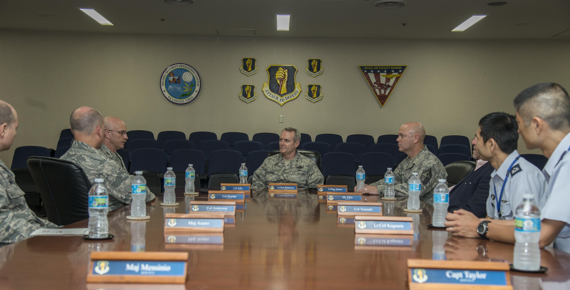 U.S. Air Force Lt. Gen. Darryl Roberson, commander, Air Education and Training Command, and AETC Command Chief Master Sgt. David Staton listen to a mission brief given by Col. R. Scott Jobe, 35th Fighter Wing commander, during their visit to Misawa Air Base, Japan, July 11, 2017. During the visit, the senior leaders were able to take a closer look at training to ensure continued support to 35th Fighter Wing maintainers. (U.S. Air Force photo by Senior Airman Brittany A. Chase)