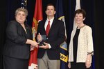 WASHINGTON (Jul. 13, 2017) Allison Stiller, left, Assistant Secretary of the Navy for Research Development & Acquisition, is joined by Dr. Delores M. Etter, as they present the 2016 Dr. Delores M. Etter Top Scientists and Engineers Award for Individual Scientists to Dr. J. Tory Cobb, Naval Surface Warfare Center, Panama City Division, during a ceremony at the Pentagon.