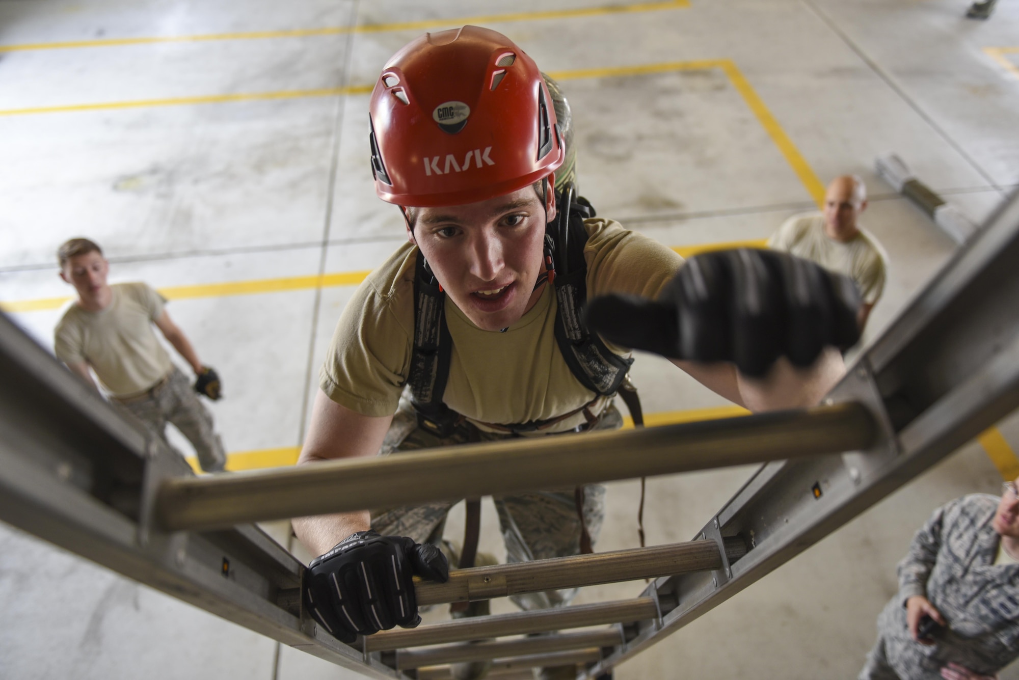 U.S. Air Force Academy Cadet 2nd Class Ryan Ramseyer climbs a ladder during a fire training challenge at Kunsan Air Base, Republic of Korea, July 11, 2017. During the course of approximately two weeks between their sophomore and junior years, cadets from the Academy visit bases around the Air Force to develop their knowledge of jobs they can apply for. The immersion program, known as Operation Air Force is vital to ensuring future leaders are aware of the jobs available to them and the impact their leadership will have once they commission. (U.S. Air Force photo by Senior Airman Michael Hunsaker/Released)