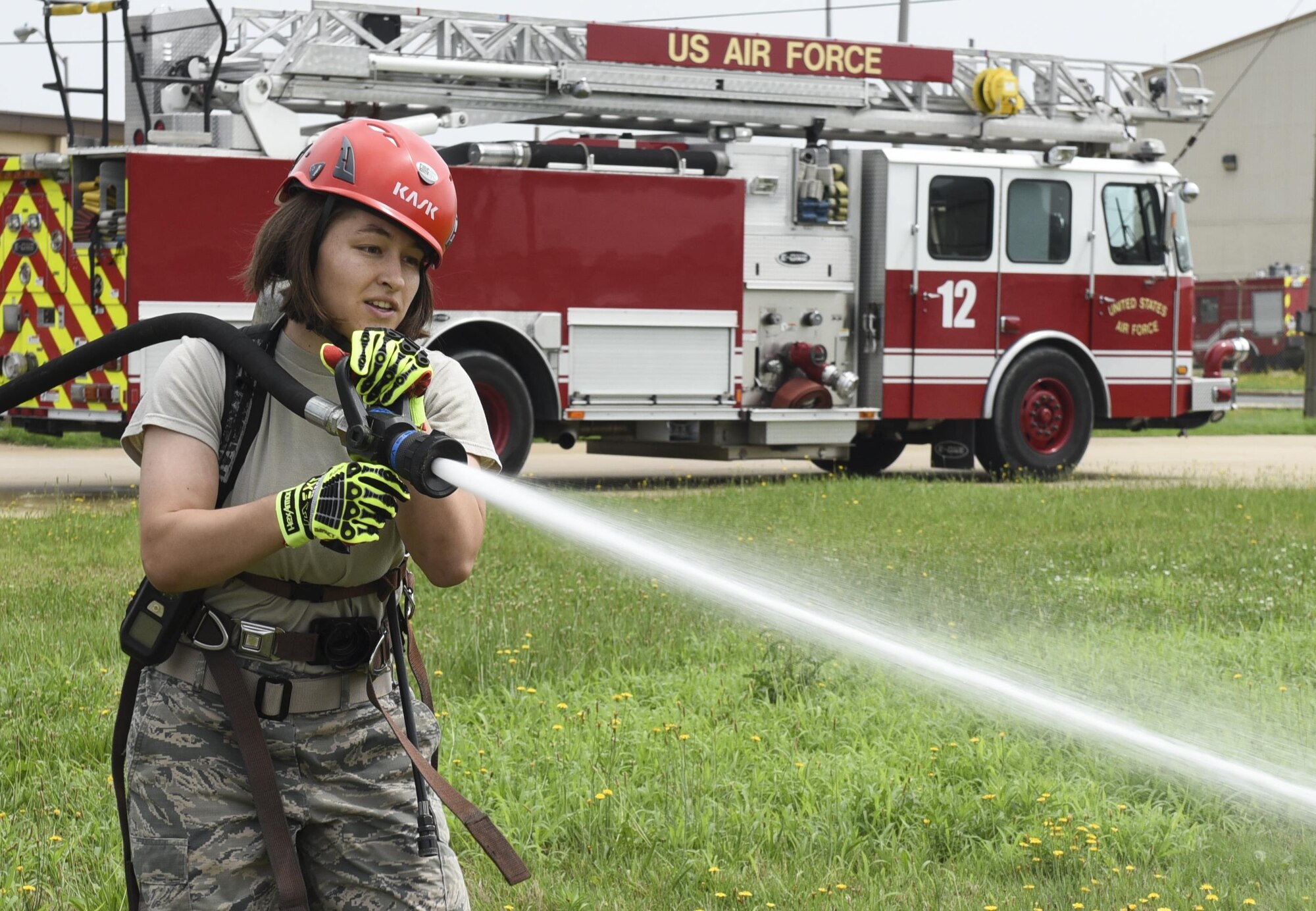 U.S. Air Force Academy Cadet 2nd Class Madison Tung sprays a fire hose during a fire training challenge at Kunsan Air Base, Republic of Korea, July 11, 2017. The visit was part of the Air Force Academy’s Operation Air Force program which allows cadets to travel different bases to learn about different careers and missions. (U.S. Air Force photo by Senior Airman Michael Hunsaker/Released)
