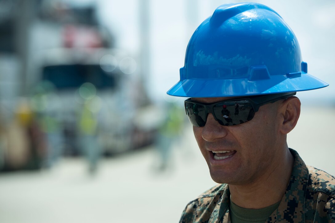 Master Sgt. Victor Garcia, the operations chief of Henoko Ammunitions Supply Point, speaks with Marines while conducting a movement of unserviceable ammunition, July 11, 2017, from the Ammunition Supply Point on Camp Schwab, Okinawa, Japan to a United States Naval Ship at Tengan Pier, Okinawa, Japan. The Marines with Ammunition Company, 3d Supply Battalion, Combat Logistics Regiment 35, 3d Marine Logistics Group, III Marine Expeditionary Force loaded up approximately 130 pallets of ammunition at the ASP to be transported and returned to the Naval Munitions Command on Sasebo Navy Base, Japan, for proper disposal. The experience of a ship-to-shore ammo movement is unique to the Marines with III MEF and benefits their forward deployed capabilities by simulating a realistic scenario that could happen during an operation.