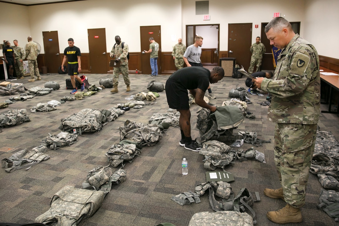 Soldiers conduct equipment layouts during the 2017 Army Materiel Command's Best Warrior Competition at Camp Atterbury, Ind., July 16, 2017. The soldiers are assigned to the Army Materiel Command. During the three-day competition, the soldiers will be tested on basic and advanced tasks and drills. Army photo by Sgt. 1st Class Teddy Wade