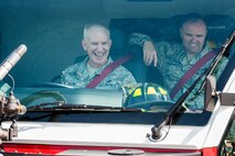 (Left) Chief Master Sgt. Alan Boling, Eighth Air Force command chief, operates a fire truck with Chief Master Sgt. Paul Elliott, 5th Bomb Wing command chief, at Minot Air Force Base, N.D., July 10, 2017. Boling visited base and spoke with 5th Civil Engineer Squadron firefighters about the critical role of front-line supervisors in Air Force Global Strike Command’s deterrence mission. (U.S. Air Force photo/Senior Airman J.T. Armstrong)