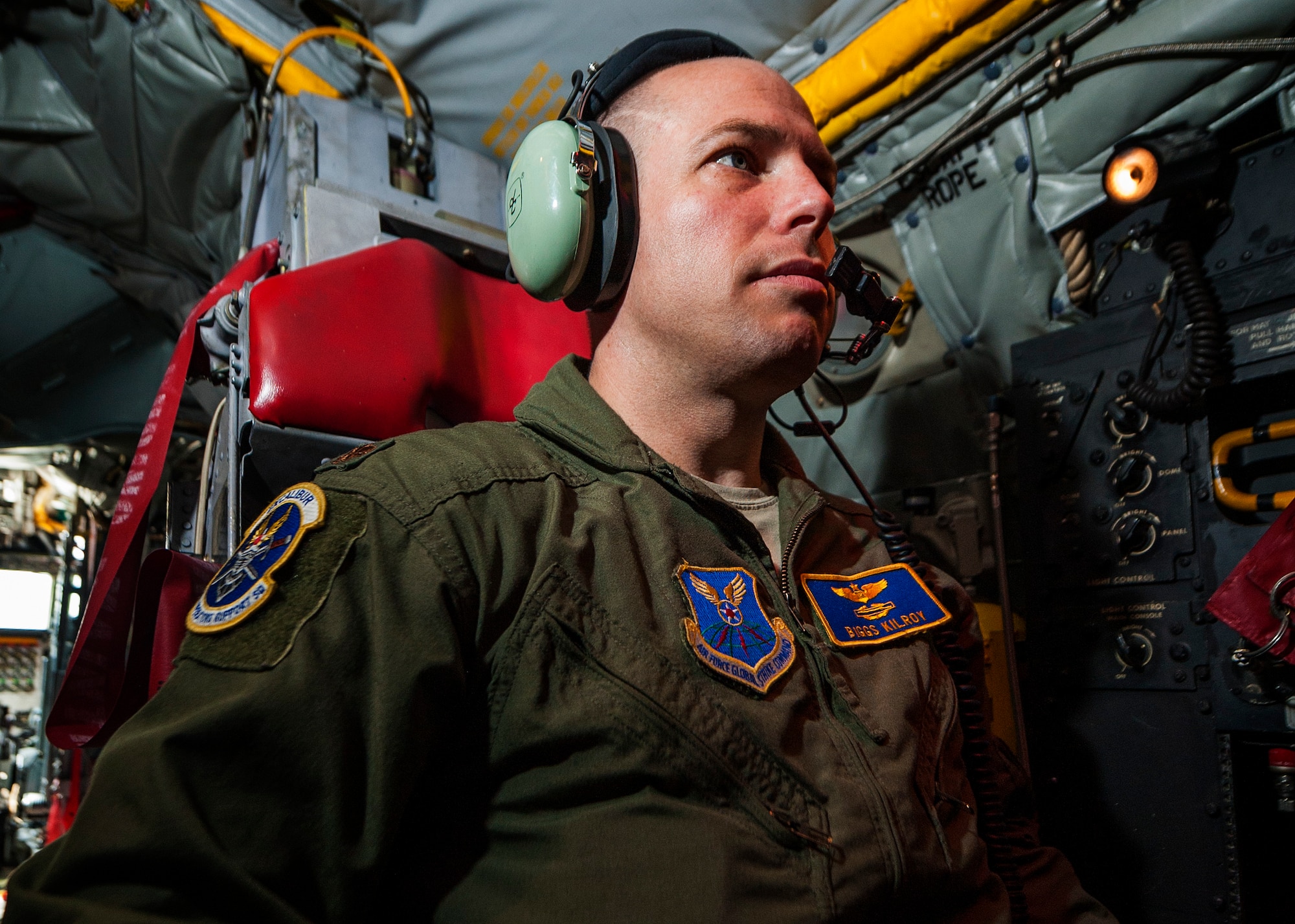 Maj. Raymond Kilroy, 5th Operation Support Squadron wing electronic warfare officer, speaks with ground crew from inside a B-52H Stratofortress during Combat Shield at Minot Air Force Base, N.D., July 12, 2017. Kilroy monitored and analyzed test radio frequencies generated by engineers on the ground. (U.S. Air Force photo/Senior Airman J.T. Armstrong)