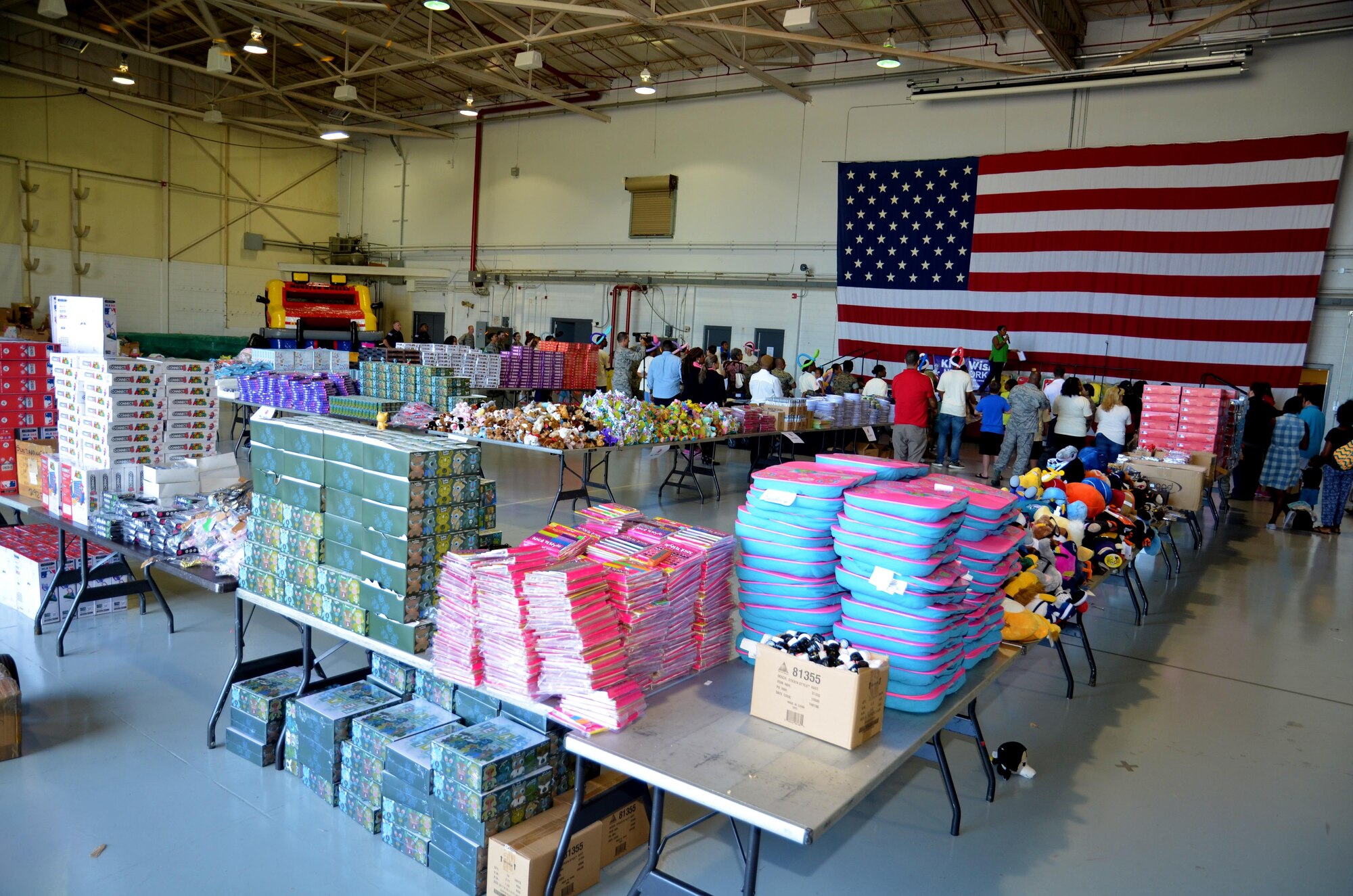 Attendees of the Military Kids Appreciation Day at Dobbins Air Reserve Base, Ga. assemble in front of the stage at the beginning of the event July 9, 2017. The 94th Airlift Wing partnered with the Kids Wish Network, a national children’s charity, to host the event that supported Dobbins military members and their children. (U.S. Air Force photo by Senior Airman Lauren Douglas)