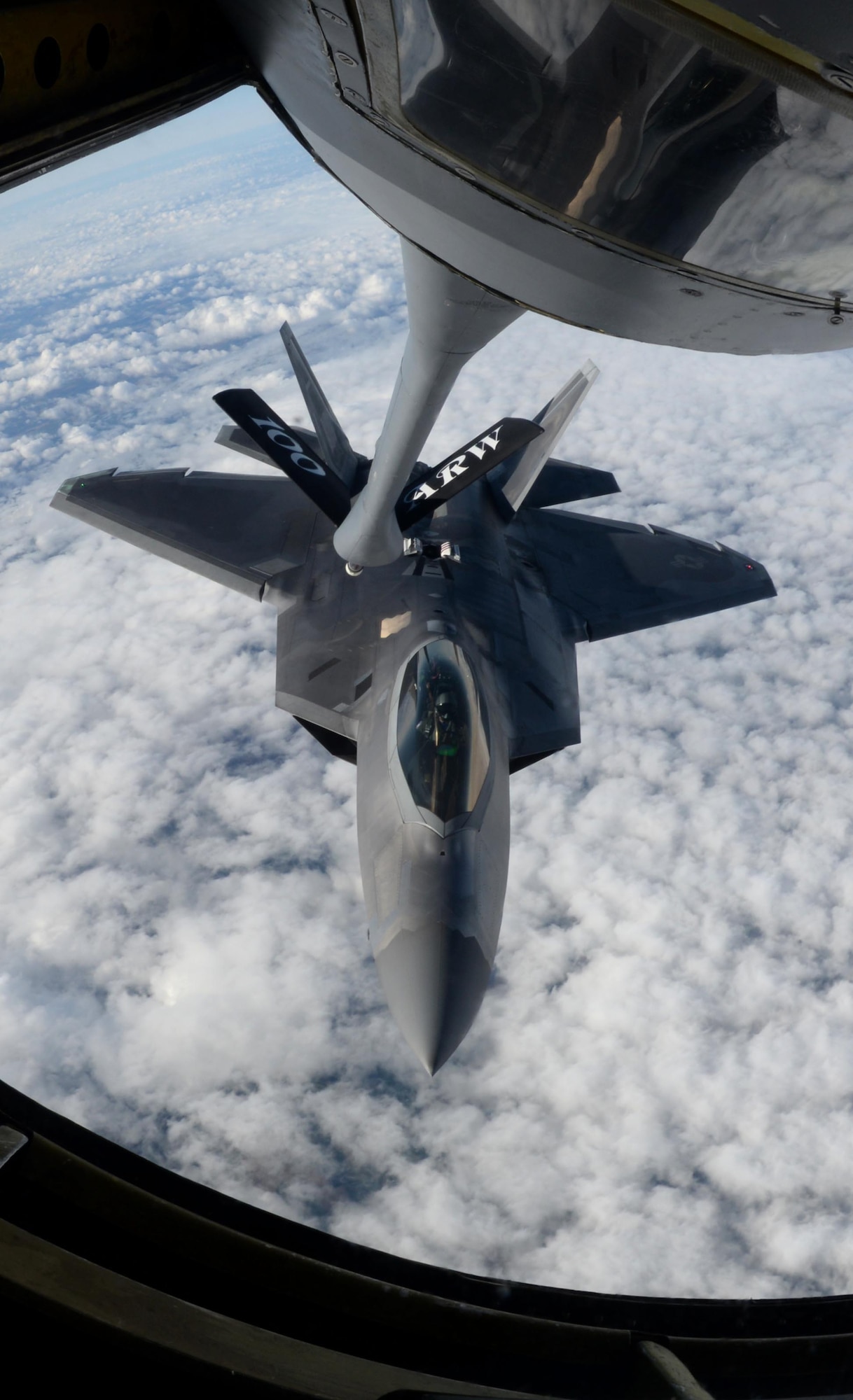 A U.S. Air Force F-22 Raptor, assigned to the Air Combat Command F-22 Demonstration Team at Langley Air Force Base, Virginia, receives fuel from a 100th Air Refueling Wing KC-135 Stratotanker, July 14, 2017, over France. The F-22 demo team performs precision aerial maneuvers to demonstrate the capabilities of the Air Force’s newest fighter aircraft. (U.S. Air Force photo by Senior Airman Justine Rho) 