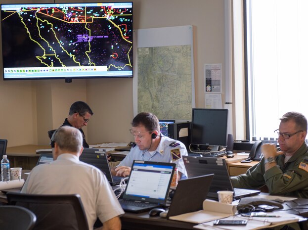 Representatives from North American Aerospace Defense Command, U.S. Northern Command, the Mexican military and U.S. and Mexican federal civilian agencies, participate in Amalgam Eagle 2017, a live-fly exercise requiring a cooperative response to a an illicit flight that crossed the U.S.-Mexico border, at the exercise command center at Peterson Air Force Base, Colorado.