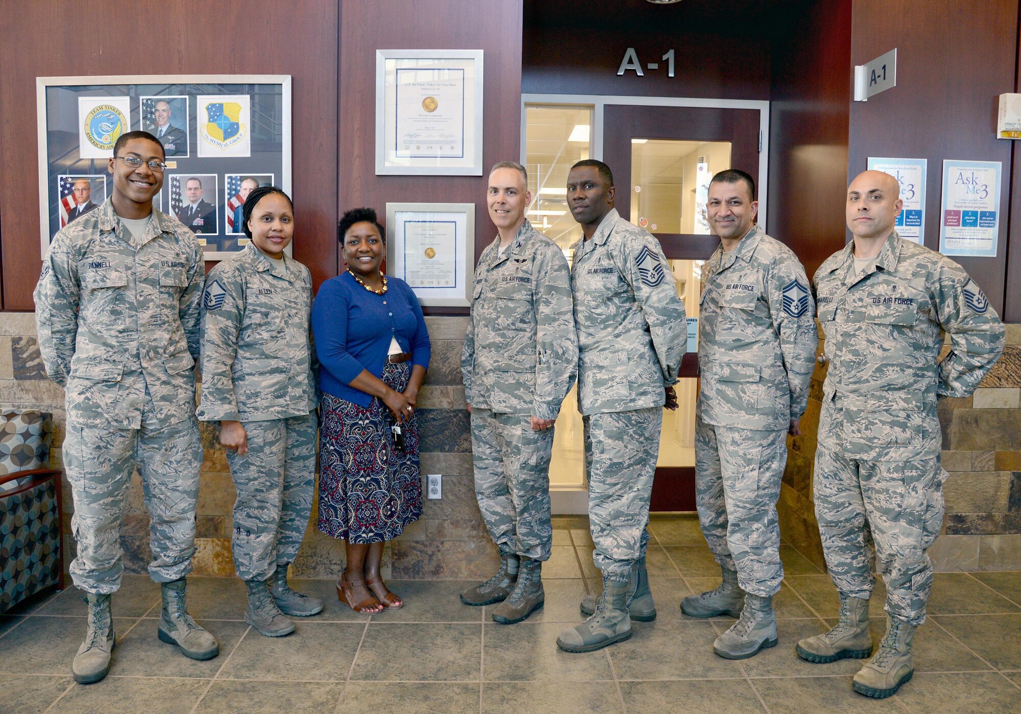 Airman 1st Class Jason Pannell, with the 72nd Medical Support Squadron; Master Sgt. Nonika Allen, with the 72nd Dental Squadron; Michaelle Gordon, Clinical Care and Risk Management officer; 72nd Medical Group Commander Col. Christopher Grussendorf; Chief Master Sgt. Paul Thomas, 72nd MDG superintendent; Senior Master Sgt. Manny Suprai, with the 72nd Medical Operations Squadron and Master Sgt. Brian Yannarelli, with the 72nd MDSS, surround a new certificate which hangs in the front lobby of the Tinker Clinic. The certificate is from The Joint commission, bestowing a three-year accreditation to the 72nd Medical Group by meeting the requirements for the Ambulatory Health Care Accreditation Program. Airman Pannell served as support staff during the Med Group's recent inspection; Sergeants Allen, Yannarelli and Suprai served as pre-surveyors; and Ms. Gordon led her team to the distinguished accomplishment. (Air Force photo by Kelly White)