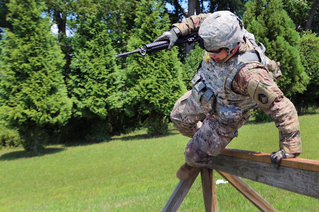 Army Staff Sgt. Joshua Laplant jumps over a hurdle during the Best Warrior Competition’s obstacle course portion of the stress shoot at Aberdeen Proving Ground, Md., July 10, 2017. Laplant is assigned to Headquarters Company, 48th Chemical Brigade. Army photo by Sgt. Kalie Jones