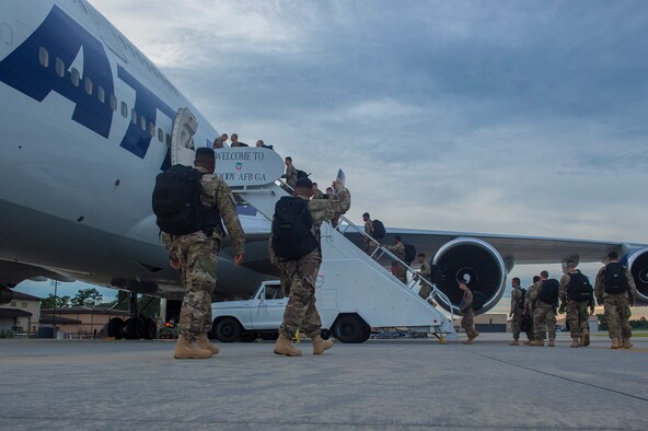 Moody Airmen board a Boeing 747 prior to deploying, July 10, 2017, at Moody Air Force Base, Ga. More than 300 Airmen deployed to Southwest Asia to aid the 74th Fighter Squadron’s A-10C Thunderbolt II mission in support of Operation Inherent Resolve. (U.S. Air Force photo by Senior Airman Greg Nash) 