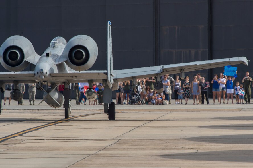 Spectators cheer on Moody’s 74th Fighter Squadron A-10C Thunderbolt II as they depart for a deployment, July 11, 2017, at Moody Air Force Base, Ga. More than 300 Airmen deployed to Southwest Asia to aid the 74th Fighter Squadron’s A-10 mission in support of Operation Inherent Resolve. (U.S. Air Force photo by Senior Airman Greg Nash)