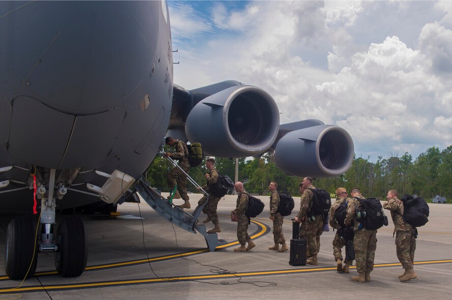 Moody Airmen board a C-17 Globemaster III in preparation for a deployment, July 11, 2017, at Moody Air Force Base, Ga. More than 300 Airmen deployed to Southwest Asia to aid the 74th Fighter Squadron’s A-10C Thunderbolt II mission in support of Operation Inherent Resolve. (U.S. Air Force photo by Senior Airman Greg Nash)