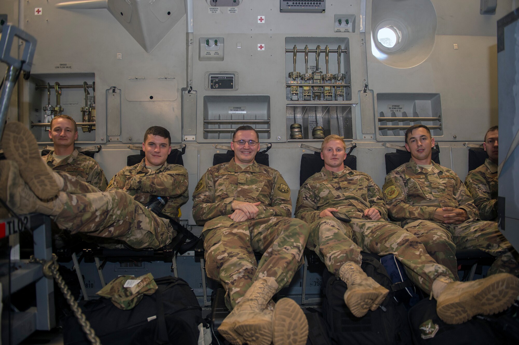 Moody Airmen await take off on a C-17 Globemaster III prior to deploying, July 11, 2017, at Moody Air Force Base, Ga. More than 300 Airmen deployed to Southwest Asia to aid the 74th Fighter Squadron’s A-10C Thunderbolt II mission in support of Operation Inherent Resolve. (U.S. Air Force photo by Senior Airman Greg Nash)