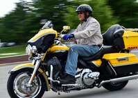 Master Sgt. Vince Bartlomain, a flight engineer with the 910th Operations Group and the motorcycle safety representative for the 910th Airlift Wing, demonstrates an exercise for his students during a motorcycle safety course  July 14, 2017, here. Bartlomain is an instructor for Motorcycle Ohio and has been teaching for 11 years. (U.S. Air Force Photo/Senior Airman Jeffrey Grossi)