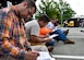 910th Airlift Wing Command Chief Master Sgt. Robert J. Potts reviews a motorcycle safety workbook when put on break from the motorcycle safety course July 14, 2017, here. The motorcycle safety course consists of group discussions, a skills test and ends with written exam. (U.S. Air Force Photo/Senior Airman Jeffrey Grossi)