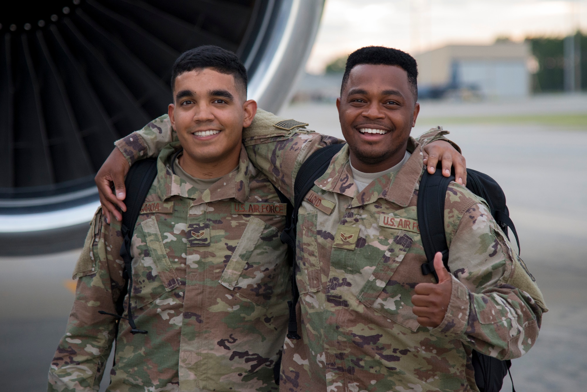 Airman 1st Class Aharon Garcia, left, and A1C Anthony Lloyd, 23d Equipment Maintenance Squadron line delivery crew chiefs, pose for a photo prior to deploying, July 10, 2017, at Moody Air Force Base, Ga. More than 300 Moody Airmen deployed to Southwest Asia to aid the 74th Expeditionary Fighter Squadron in support of Operation Inherent Resolve. (U.S. Air Force photo by Airman 1st Class Erick Requadt)