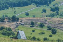 Army Reserve Engineers, 926th  Engineer Brigade, operate scrapers in formation to move 100,000 cubic meters of dirt from a hill top during Resolute Castle 17, in Cincu Romania, July 14, 2017.  Resolute Castle 2017 is a U.S. Army Reserve led, United States Army Europe sponsored, Multi-Component, Multi-National Engineer Readiness Training Exercise.   Resolute Castle improves interoperability, enhances confidence and security assurance between partner nations, and improve infrastructure, capability and capacity at select locations.