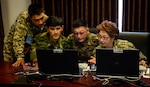 Exercise participants collaborate on a mission plan during multinational exercise Regional Cooperation 2017, July 14, 2017, in Dushanbe, Tajikistan. Regional Cooperation has been conducted annually since 2001; the last exercise was held Sept. 16-28, 2016, in Cape Cod, Massachusetts. (U.S. Air Force photo by Staff Sgt. Michael Battles)