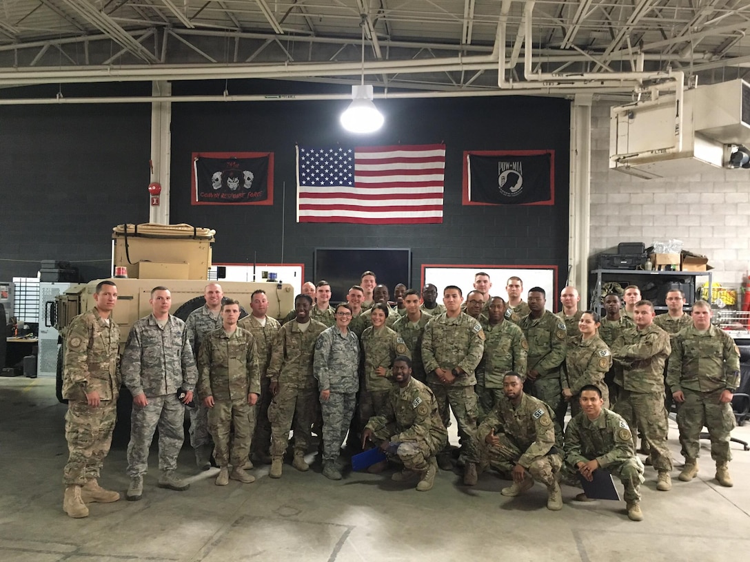 Chief Master Sgt. Amber Mitchell, 341st Missile Wing command chief, center, poses for a photo with Airmen from the 741st Missile Security Forces Squadron convoy response force at Malmstrom Air Force Base, Mont. One of Mitchell’s goals is to get to know the Airmen that make up the wing, working on the base and in the missile field. (Courtesy photo)