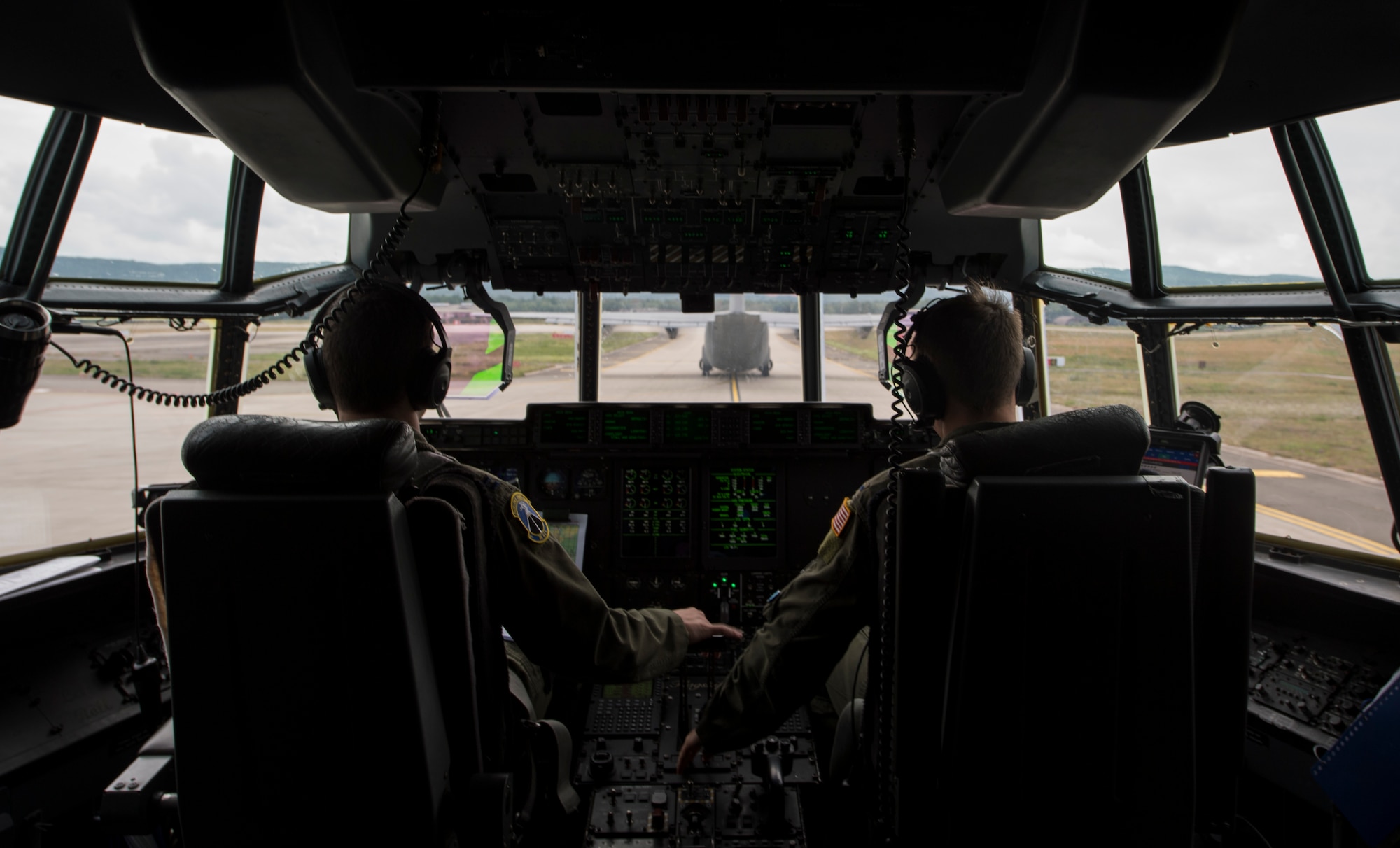 U.S. Air Force Capt. Timothy Vedra, 37th Airlift Squadron pilot, taxis a C-130J Super Hercules on Ramstein Air Base, Germany, July 10, 2017. Vedra and other U.S. Air Force Airmen participated in International Jump Week alongside more than 13 partner nations. (U.S. Air Force photo by Senior Airman Tryphena Mayhugh)