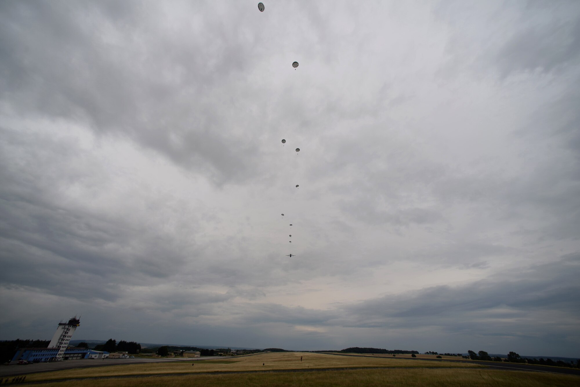 Parachutists descend from the sky during International Jump Week in Bitburg, Germany, July 11, 2017. Approximately 500 service members from more than 13 partner nations participated in this year’s training. (U.S. Air Force photo by Airman 1st Class D. Blake Browning)