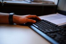 Danny Hobel, 435th Construction and Training Squadron, administrative service clerk apprentice, types on his keyboard, on Ramstein Air Base, Germany Jul. 13, 2017. Prospective apprentices applying to work with the 435th CTS find themselves competing with their peers for job openings. (U.S. Air Force photo by Airman 1st Class Joshua Magbanua) 