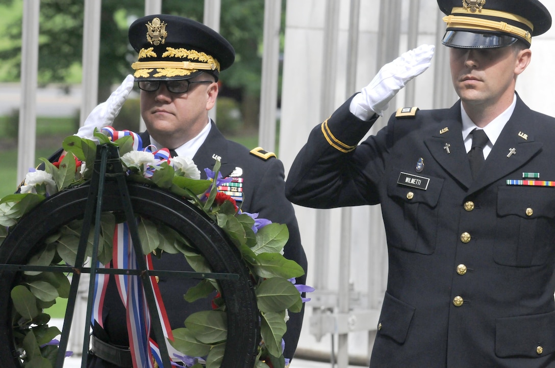 Brigadier General Stephen E. Strand, deputy commanding general for the U.S. Army Reserve's 88th Regional Support Command, and Chaplain (Capt.) Timothy Wilmetti, chaplain for the 489th Civil Affairs Battalion, render honors during the playing of Taps after placing a wreath at the tomb for the 29th President of the United States Warren G. Harding during a ceremony in Marion, Ohio, July 15.
