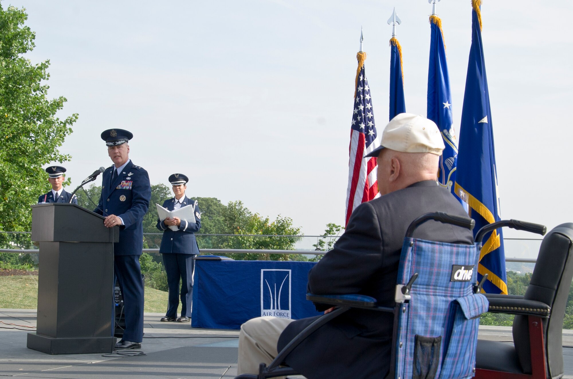 Maj. Gen. James A. Jacobson (standing at podium), Air Force District of Washington commander, delivers remarks at a Purple Heart award ceremony July 14, 2017 at the U.S. Air Force Memorial, Arlington, Va. The award was approved for World War II veteran Lt. Pedevillano (right) 72 years after he was liberated from a German prisoner of war camp by Gen. George S. Patton, Jr.’s 3rd U.S. Army. (Air Force photo by Staff Sgt. Joe Yanik)