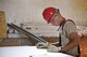 Airman 1st Class Michael Wisherd, 219th RED HORSE Squadron airfields apprentice, measures a piece of sheetrock June 14, 2017 at the Bile barn, Pocek Base, near Postonja, Slovenia. Wisherd is built a wall to insulate a water tank for Exercise Immediate Response to occur later in 2017. (U.S. Air National Guard photo/Staff Sgt. Lindsey Soulsby)