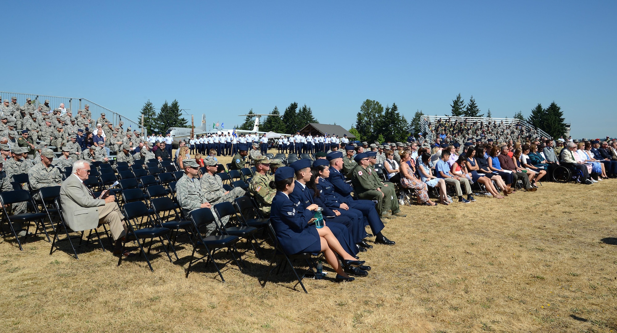 Airmen, Soldiers and distinguished guests listen to comments from Lt. Gen. Giovanni Tuck, 18th Air Force commander, during the 62nd Airlift Wing change of command July 14, 2017, at Joint Base Lewis-McChord, Wash. Tuck presided over the ceremony, transferring command from Col. Leonard Kosinski to Col. Rebecca Sonkiss. (U.S. Air Force photo/Senior Airman Jacob Jimenez)  