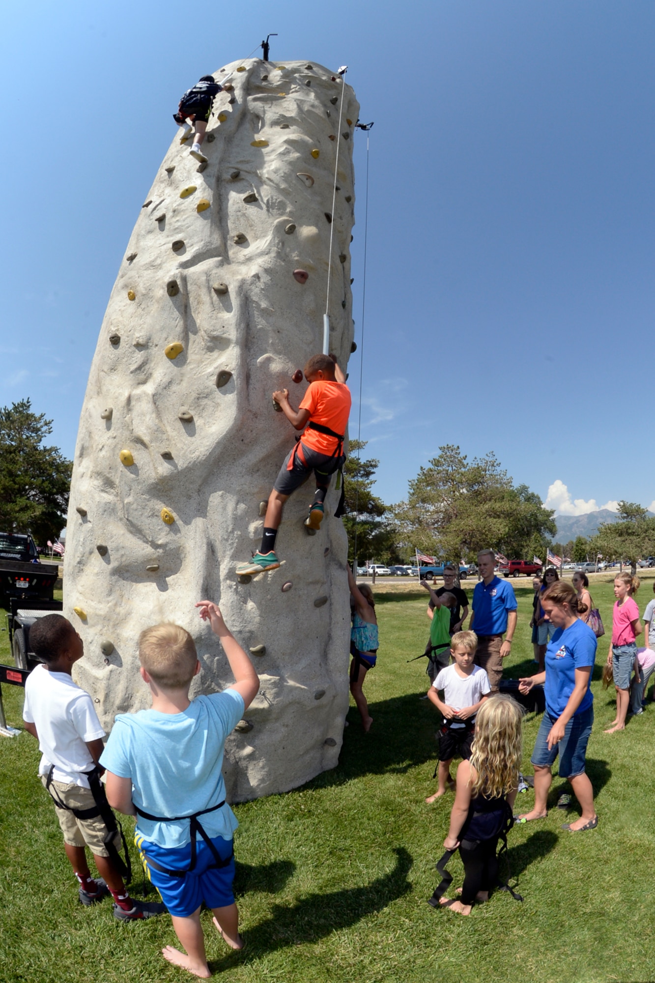 Tyler and Amanda Barlow with Class Ropes Course, a local community sponsor, gives children a chance to test their climbing skills during the Salute Picnic, July 14 at Centennial Park. The event pulled dozens of community sponsors together to provide a day of food and fun for military members and families, and showed appreciation to those who serve. (Air Force photo/Todd Cromar)