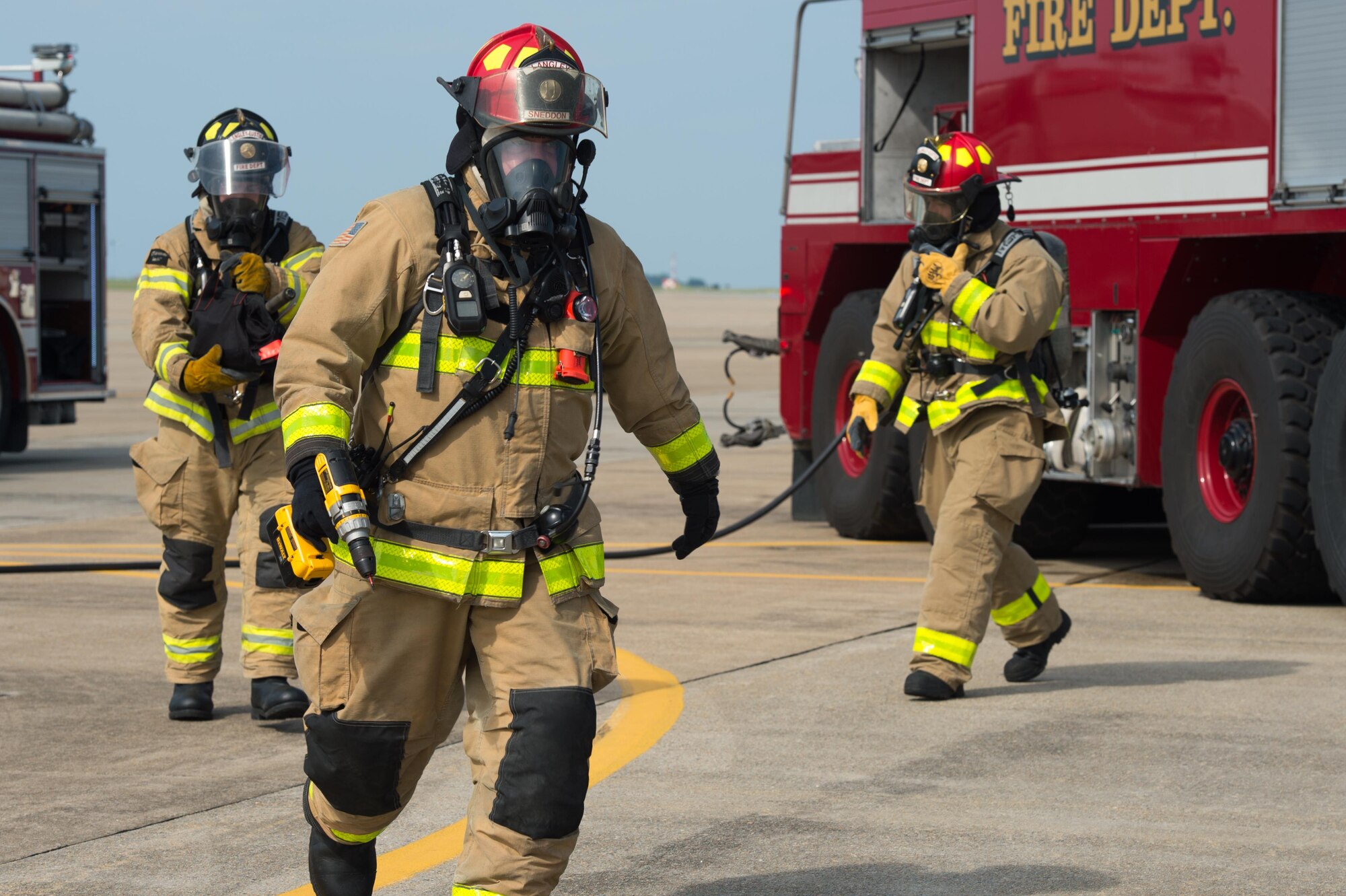 U.S. Air Force Airmen assigned to the 633rd Civil Engineer Squadron respond to an aircraft incident during an exercise at Joint Base Langley-Eustis, Va., July 11, 2017. During the exercise, the installation tested and evaluated emergency response capabilities for an aircraft incident. (U.S. Air Force photo/Senior Airman Derek Seifert)