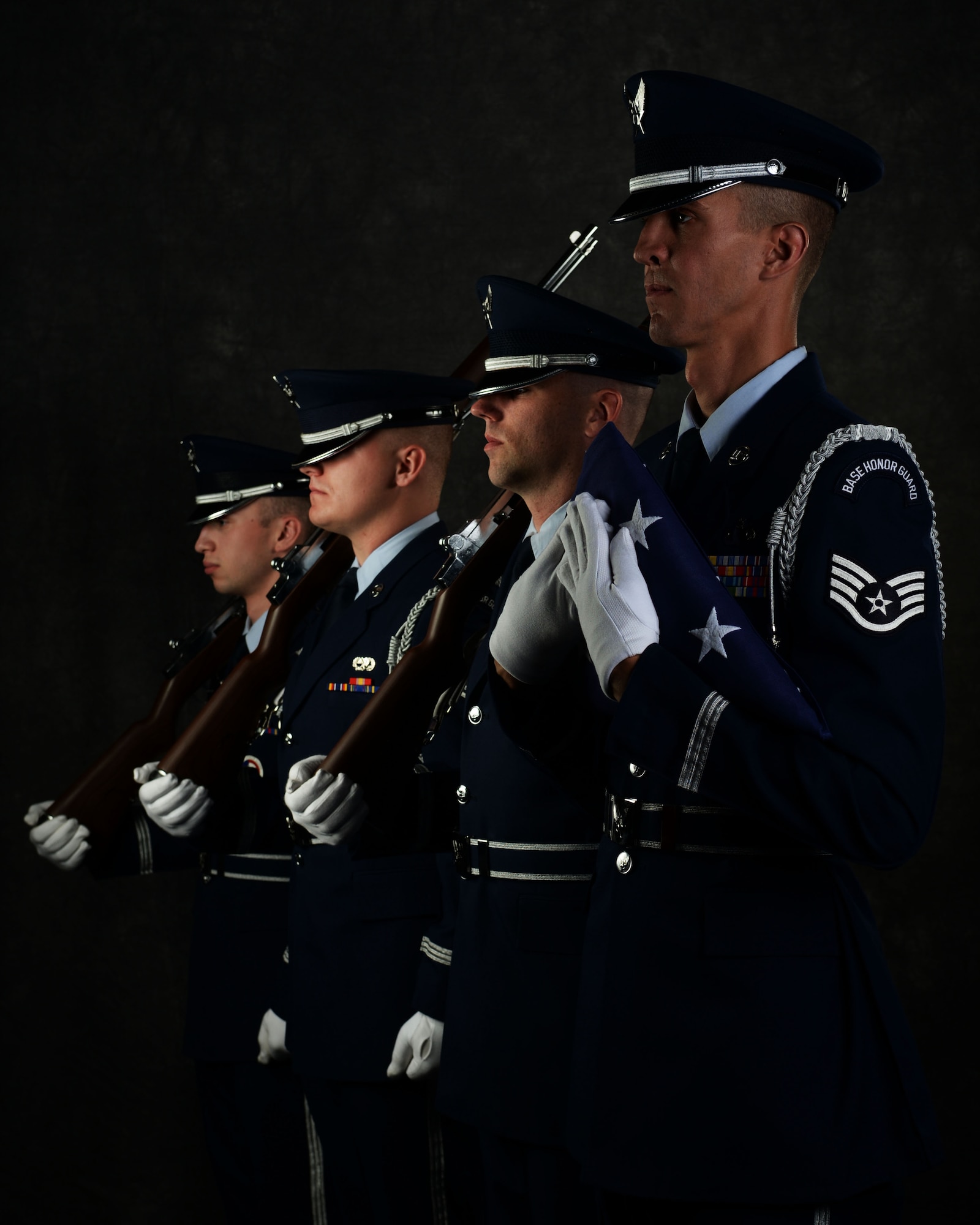 Staff Sgt. Michael J. Solo, 5th Force Support Squadron NCOIC of the base honor guard, poses with his honor guardsmen at Minot Air Force Base, N.D., June 26, 2017. The honor guard attends many ceremonies, to include colors team sequences with both flags and rifles, funeral sequences, pallbearing, firing party, flag folding, sword cordons and other ceremonies. (U.S. Air Force photo by Airman 1st Class Dillon J. Audit)

