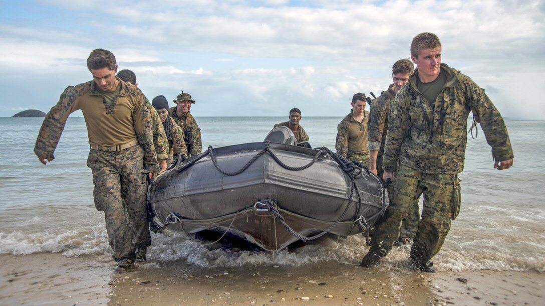 Marines carry a combat rubber raiding craft to the beach on Townshend Island, Australia, as part of a large-scale amphibious assault exercise during Talisman Saber 2017. Talisman Saber is a biennial U.S.-Australia exercise. Navy photo by Petty Officer 2nd Class Sarah Villegas 