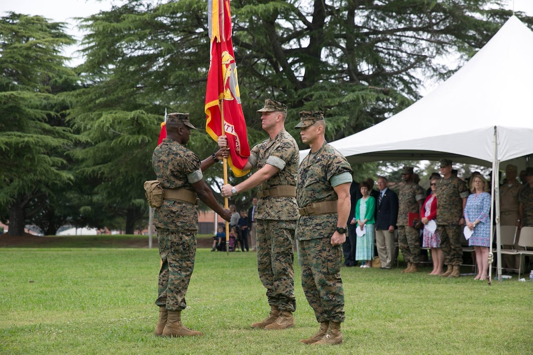 Col. John Evans Jr. relinquishes his command to Col. Brian Neil, commanding officer, Marine Corps Security Force Regiment, aboard Naval Weapons Station Yorktown, Va., June 16. Neil took command of MCSFR after serving as branch head of officer accessions at Manpower and Reserve Affairs, Headquarters Marine Corps. Evans will be assigned to Plans, Policy and Operations. (U.S. Marine Corps photo by Sgt. Kayla D. Rivera/Released)