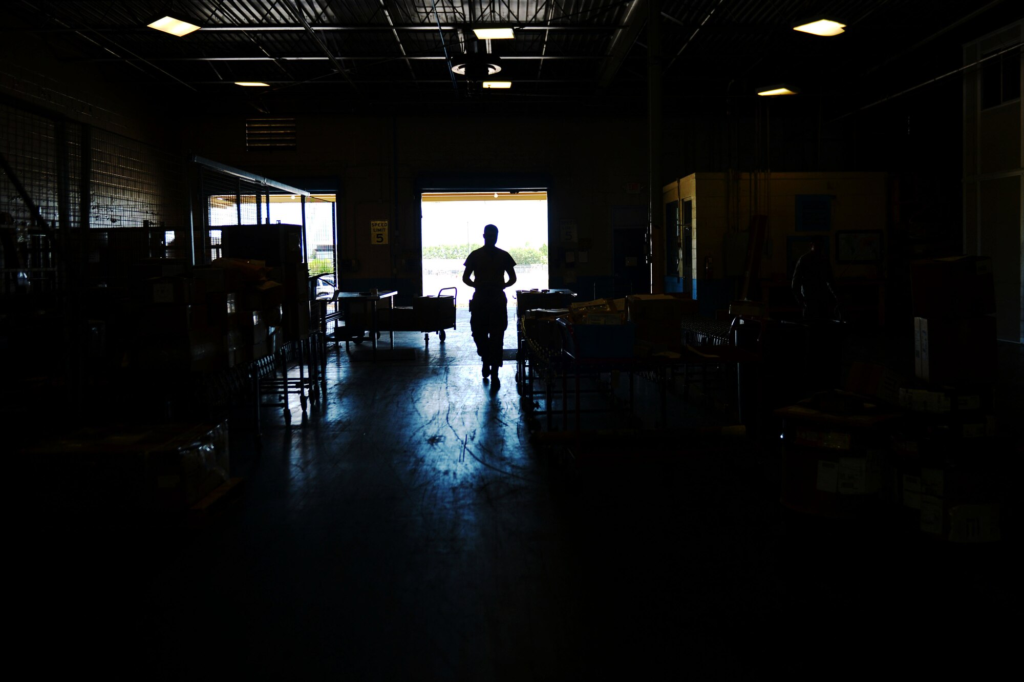 U.S. Air Force Senior Airman Tyler Peterson, 20th Logistics Readiness Squadron (LRS) inbound cargo technician, relocates packages at the 20th LRS cargo facility at Shaw Air Force Base, S.C., July 13, 2017. Inbound cargo receives base shipments and prepares packages for transportation to their respective facilities. (U.S. Air Force photo by Senior Airman Christopher Maldonado)