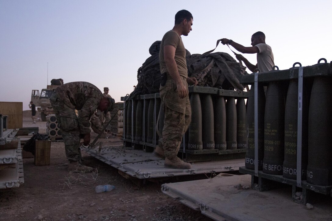 Paratroopers work late into the evening preparing munitions for movement at Forward Operating Base Shalalot, Iraq, July 6, 2017. Army photo by Sgt. Christopher Bigelow