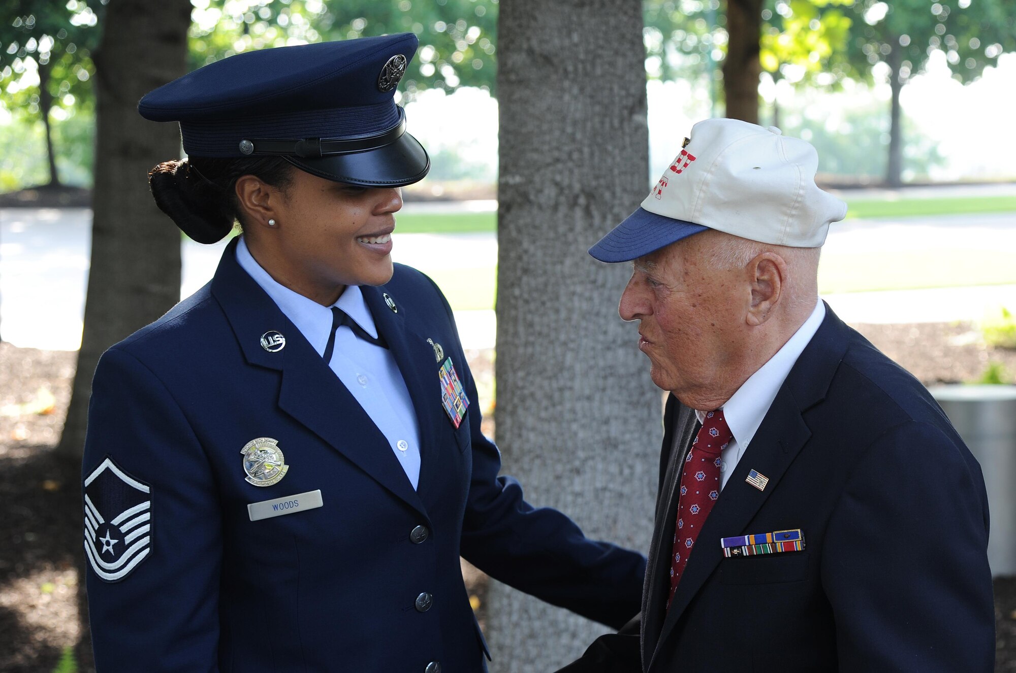 Master Sgt. Tamekia Wood, U.S.Air Force Honor Guard, assists  2nd Lt. (Ret.) John Pedevillano before his  Purple Heart award ceremony on July 14, 2017 at the U.S. Air Force Memorial, Arlington, Va.  Maj. Gen. James A. Jacobson, Air Force District of Washington commander, hosted the Purple Heart award ceremony and presented the prestigious award to 2nd Lt. (Ret.) John Pedevillano for wounds he incurred during a forced march as a World War II prisoner of war in Germany. Pedevillano, a B-17 bombardier pilot, and his crew assigned to the 306th Bomb Group of the “Mighty Eighth” Air Force were shot down during a bombing mission in airspace over Nazi Germany on April 24, 1944.  Per U.S. Army regulation, 600-8-22 Ch. 2, Par. 8, the Purple Heart is awarded in the name of the President of the United States to any member of the U.S. Armed Forces who, after April 5, 1917, has been wounded, killed, or has died from wounds while serving under competent authority in any capacity with one of the U.S. Armed Services. (U.S. Air Force Photo by Mr. James E. Lotz/)(Released) 