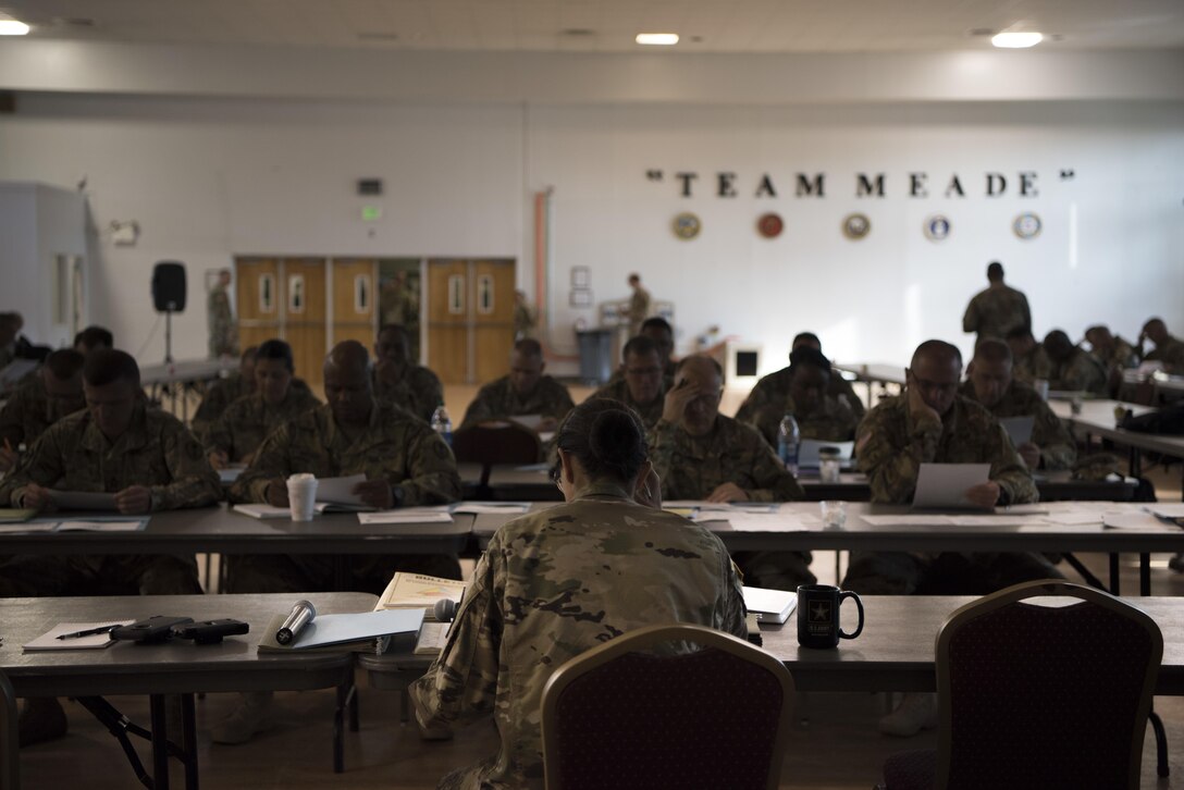 Command Sgt. Maj. Ted L. Copeland, command sergeant major of the Army Reserve, speaks to leadership from the 200th Military Police Command and its subordinate units during a conference at McGill Training Center at Fort Meade, Maryland, July 15, 2017. Joining Copeland is Command Sgt. Maj. Craig Owens, the command sergeant major for the 200th MP Command. The command hosted a Quarterly Training Briefing conference at Fort Meade from July 15-17, to strategize on future needs, and how they support the U.S. Army Reserve Command’s focus on combat readiness. Owens reminded the leadership to “focus on training as a unit, a team. It's the team that goes to war and wins." (U.S. Army Reserve Photo by Sgt. Audrey Hayes)