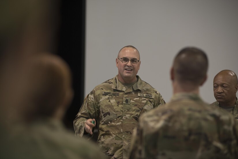 Command Sgt. Maj. Ted L. Copeland, command sergeant major of the Army Reserve, speaks to leadership from the 200th Military Police Command and its subordinate units during a conference at McGill Training Center at Fort Meade, Maryland, July 15, 2017. Joining Copeland is Command Sgt. Maj. Craig Owens, the command sergeant major for the 200th MP Command. The command hosted a Quarterly Training Briefing conference at Fort Meade from July 15-17, to strategize on future needs, and how they support the U.S. Army Reserve Command’s focus on combat readiness. Owens reminded the leadership to “focus on training as a unit, a team. It's the team that goes to war and wins." (U.S. Army Reserve Photo by Sgt. Audrey Hayes)