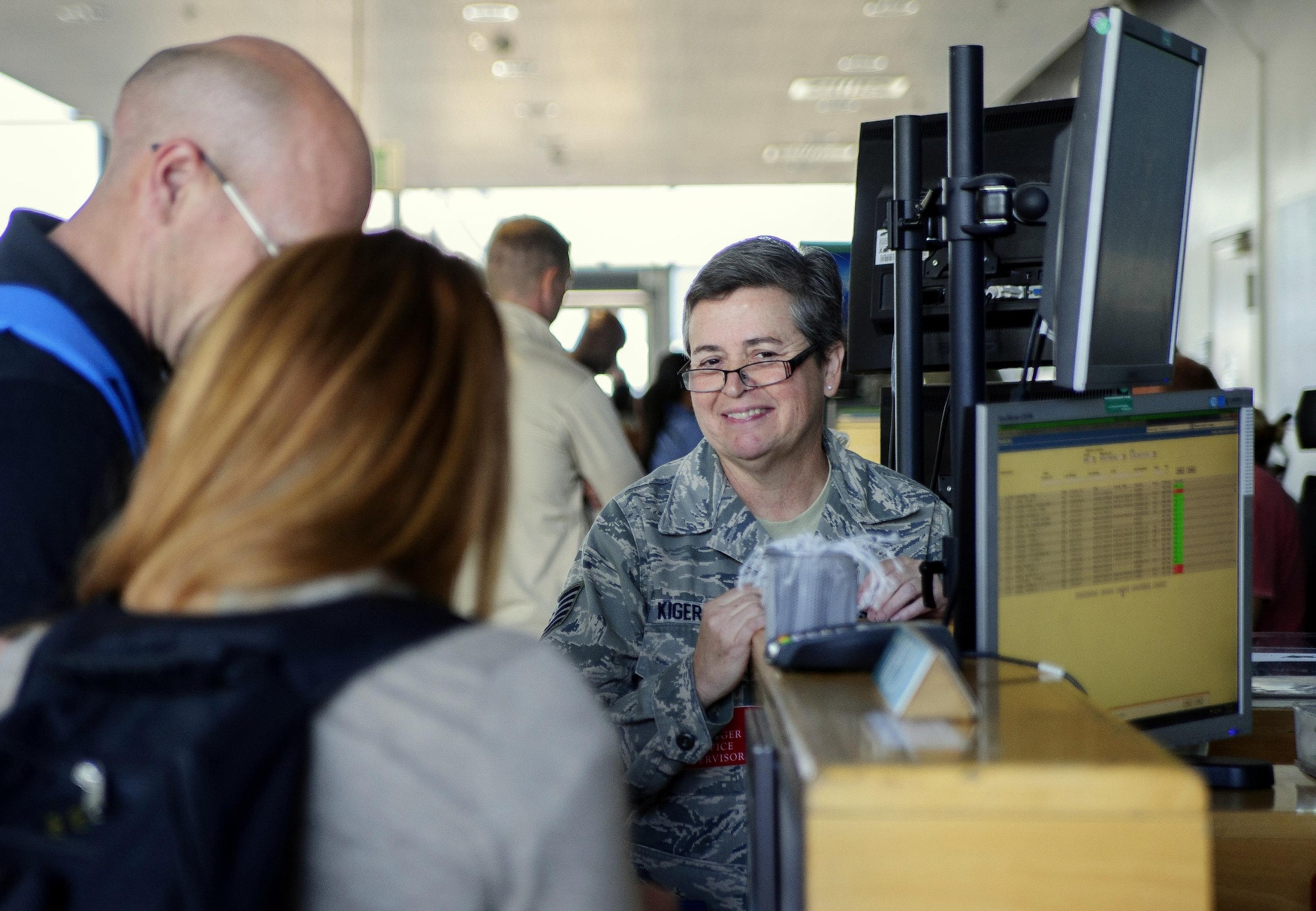 Tech. Sgt. Renee Kiger checks in and issues tickets to passengers at Ramstein Air Base's passenger terminal, July 13, 2017.  As a passenger terminal specialist and Air Transportation Journeyman with Joint Base Charleston's 81st Aerial Port Squadron, Kiger helped train at Ramstein with the active duty 721st APS.  Because Ramstein's Aerial Port is configured differently - and is much larger - than JB Charleston's, it serves as an opportunity for real-world training for the 81st APS's Citizen Airmen.  (U.S. Air Force photo by Senior Airman Jonathan Lane) 

