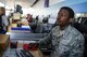 Senior Airman Marquise White, Air Transportation Journeyman with Joint Base Charleston's 81st Aerial Port Squadron, checks in passengers at Ramstein Air Base's passenger terminal, July 13, 2017.  As a passenger terminal specialist, White assists with ensuring all passengers are screened, their baggage checked, and that passengers have all authorizations and documents before assigning them a seat on a departing military aircraft.  Reservists from JB Charleston trained at Ramstein in July 2017 to help stay ready for any upcoming deployments.  (U.S. Air Force photo by Senior Airman Jonathan Lane)